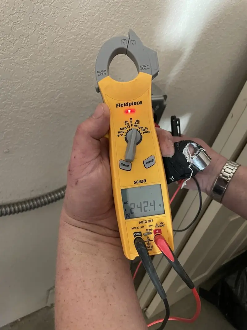 Voltage testing with clamp meter during Electrical Installation Services in Medfield